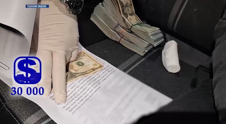 В Ташкенте ранее судимый помощник хокима задержан при получении 30 тыс. долларов США - видео